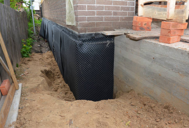 SJ Waterproofing Pros technician performing targeted Exterior Waterproofing assessment in Hammond, WI